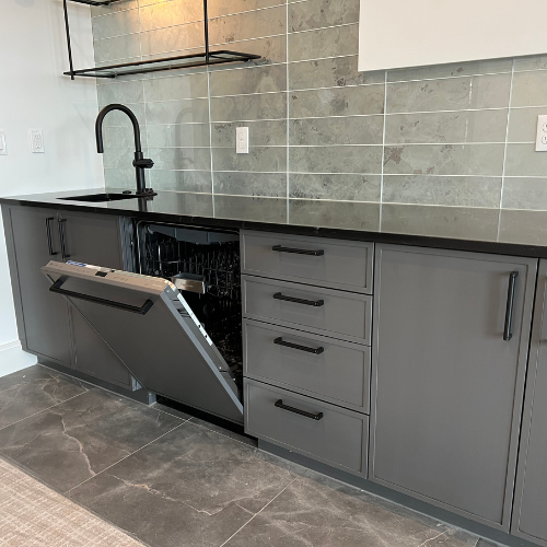 showroom kitchen counter, opened dishwasher 